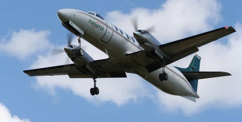 location jet privé: METRO III en vol, ciel partiellement nuageux.