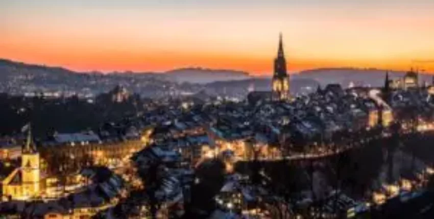Privatjet mieten nach Bern, vue aérienne au coucher du soleil.